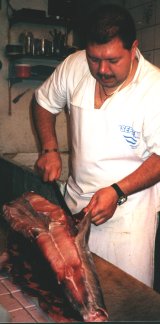 Gutting fish in the Mercado Central in San Jose